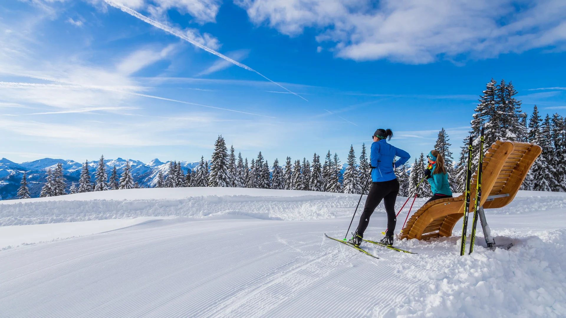 Bauernhof Krahlehen © Coen Weesjes Two cross-country skiers in snow with snowy trees and mountains in background