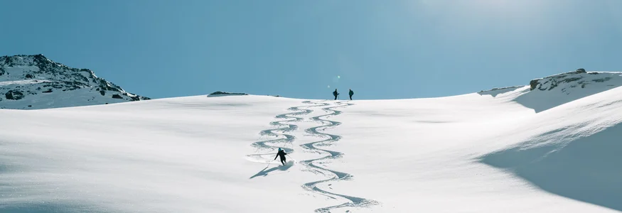 Passeiertal Valley © Tourismusverein Passeiertal - Benjamin Pfitscher Skier carving tracks in fresh snow on sunny mountain slope