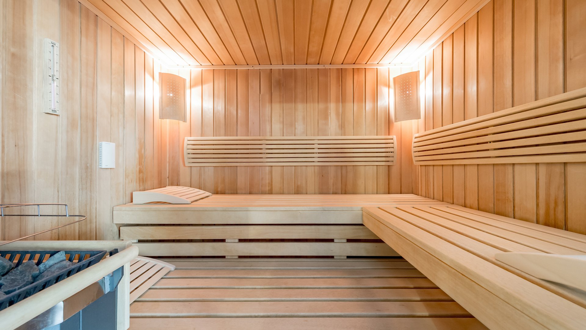 Interior of a modern Finnish sauna with light wood paneling