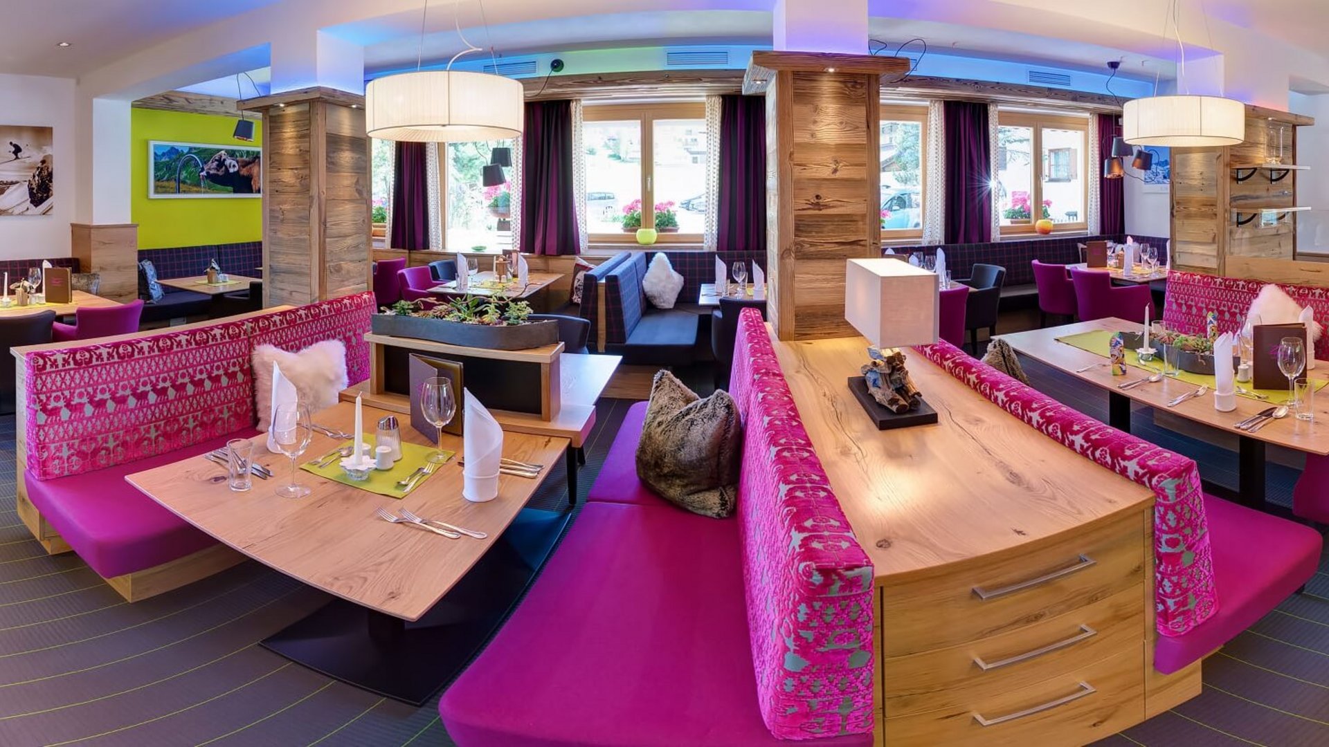 Cozy restaurant with wooden furniture and purple seating