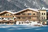 Collective enquiries © Reinhold Glaser Snow-covered old wooden house in front of forested mountain in winter