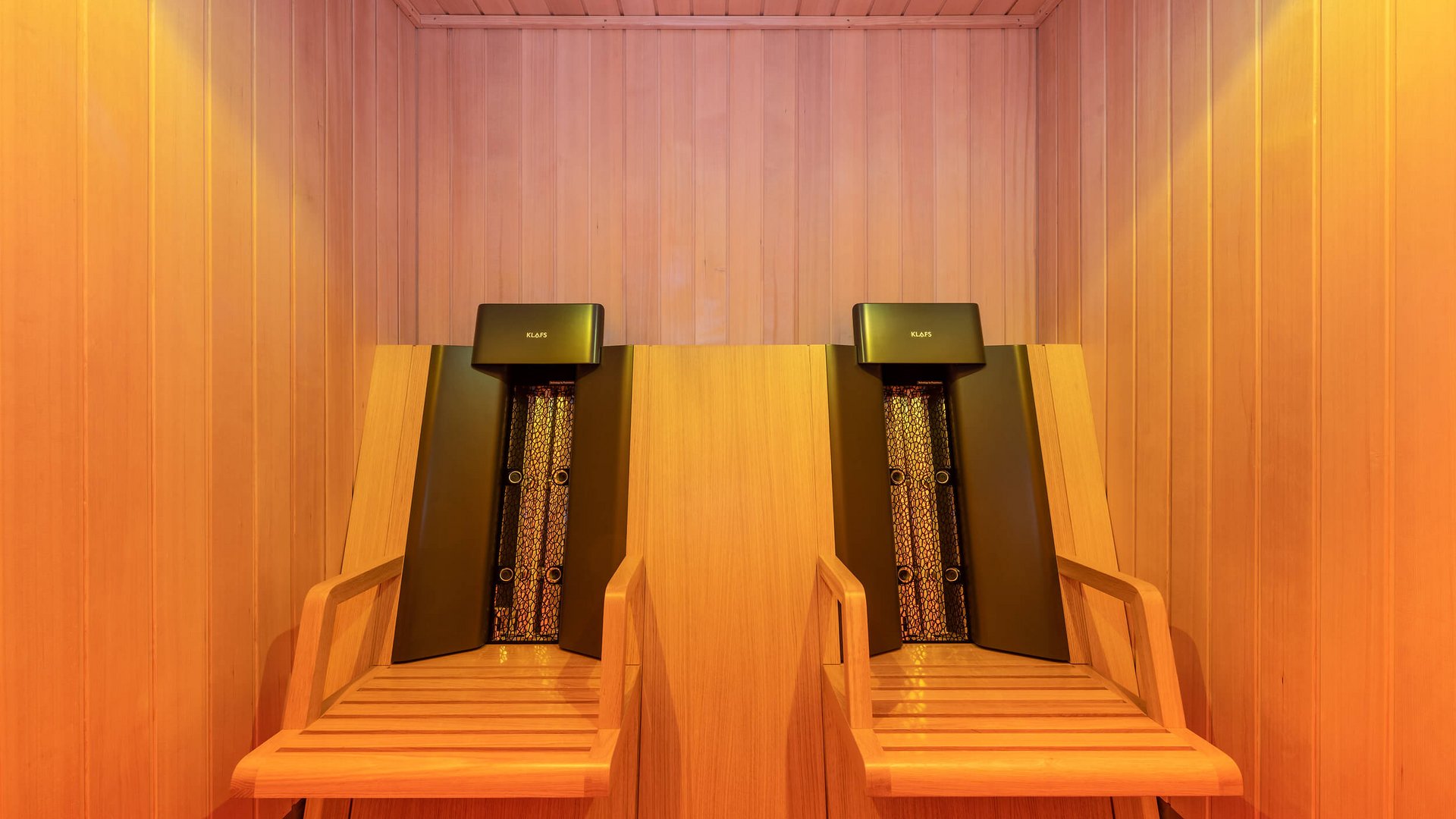 Wood sauna with two ergonomic recliner chairs and heaters
