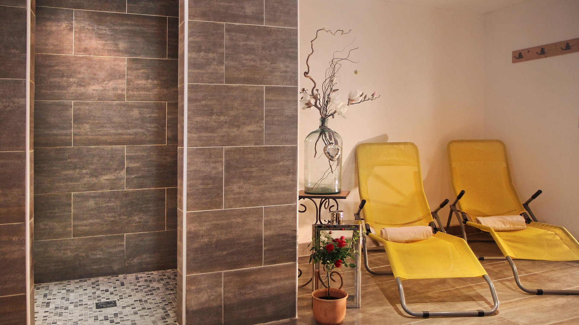 Relaxation area with yellow lounge chairs and flower decoration