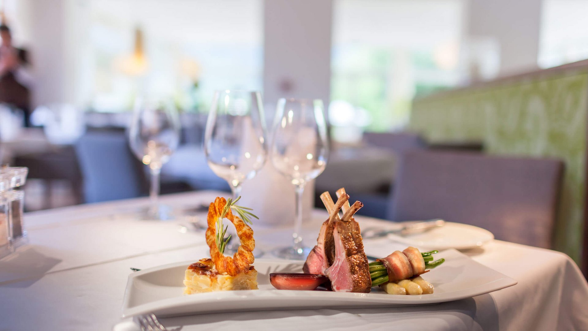 Gourmet dishes on elegant white plate in fine dining restaurant