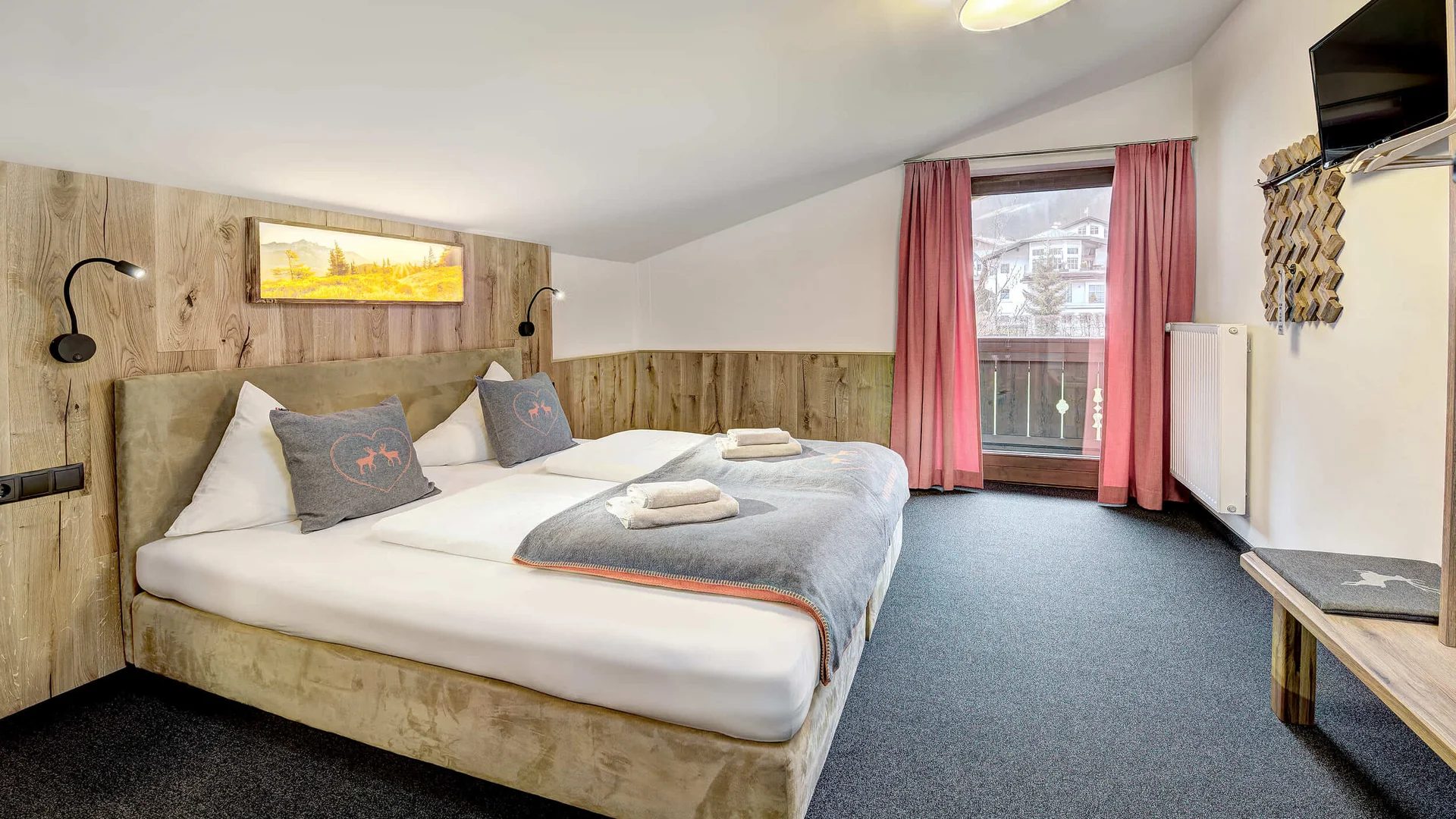 Cozy hotel room with large bed and balcony window