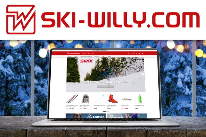 Laptop zeigt ski-willy.com Webseite mit Wintersportausrüstung vor verschneitem Fenster