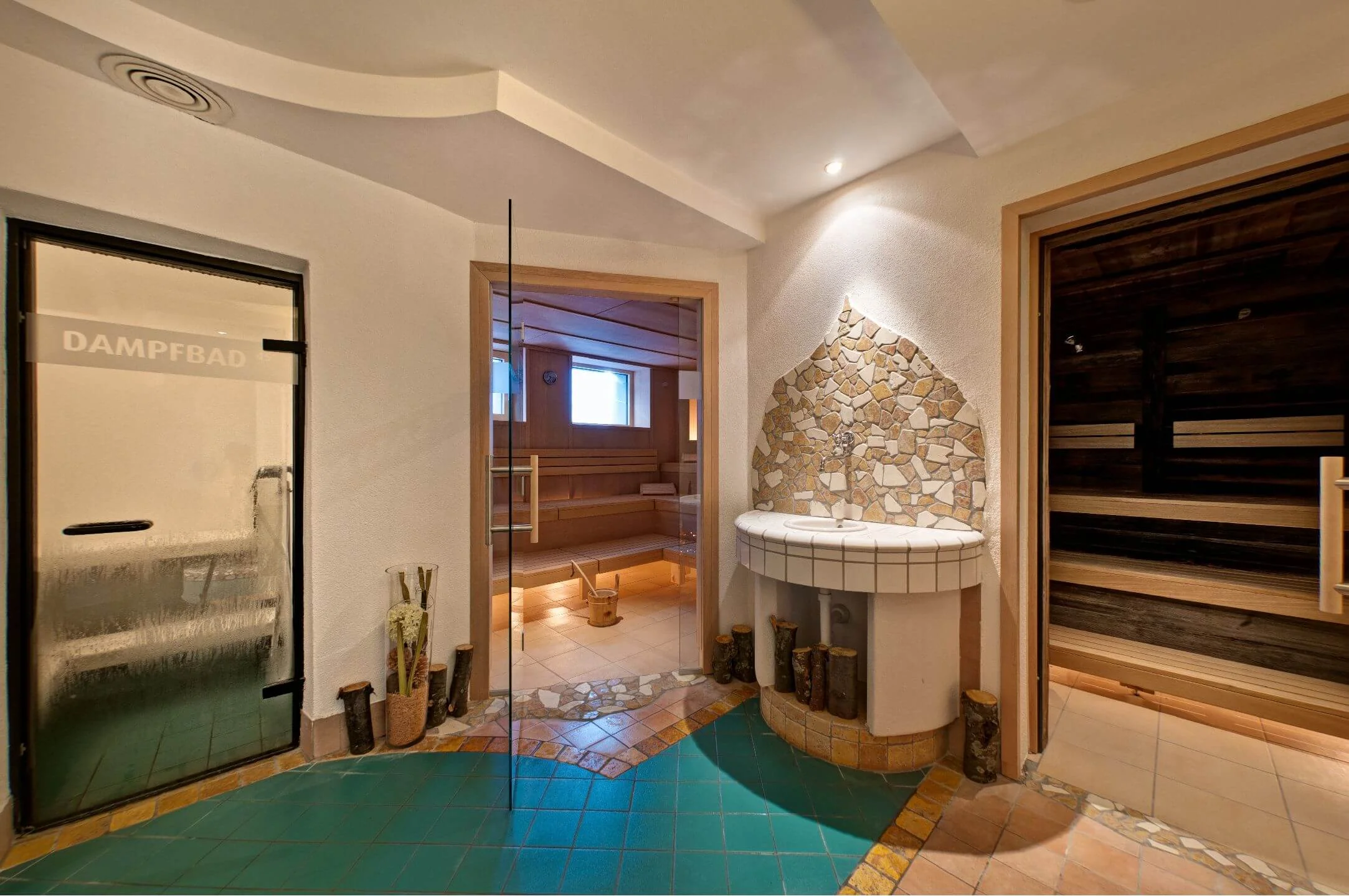 Cross-country skiing & wellness © Hotel Toni - Familie Walter KG Entrance to steam room, steam bath, and wood sauna in spa area