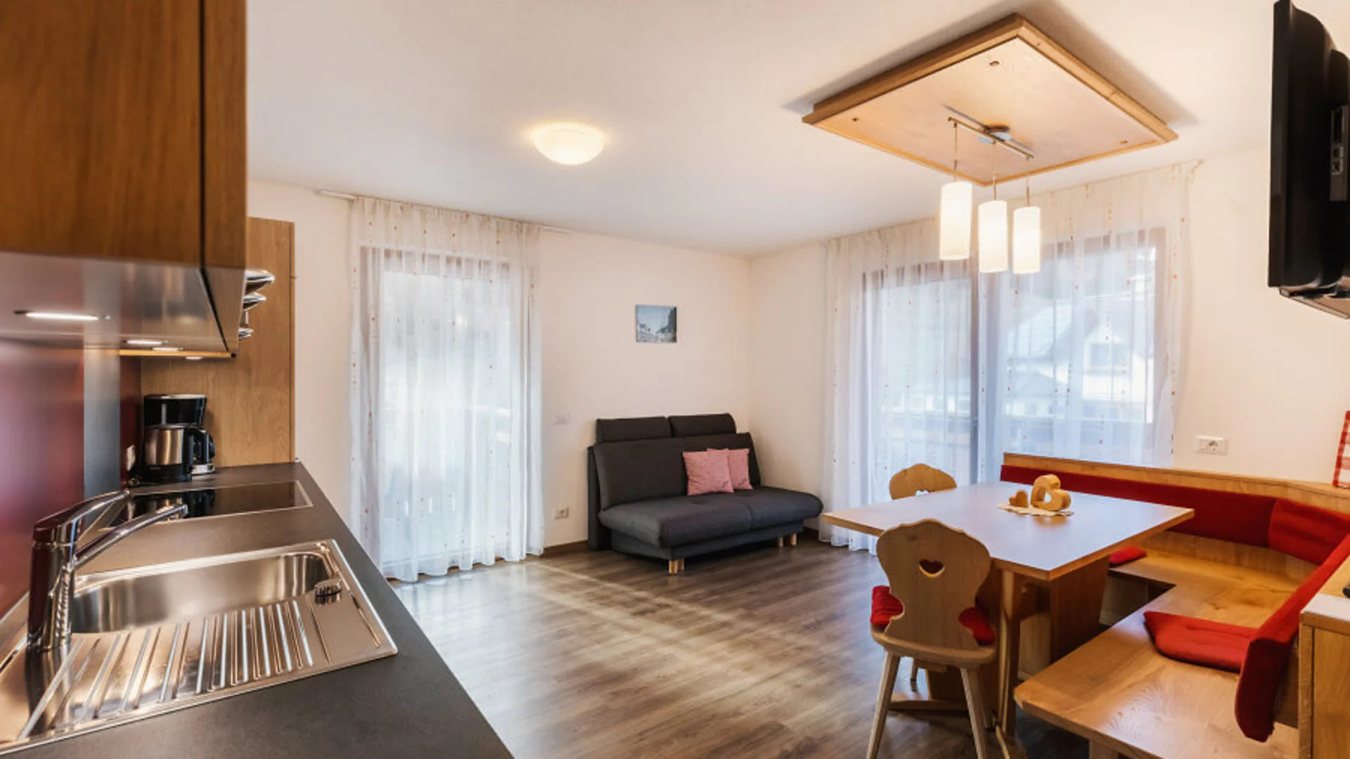 Bright kitchen with dining area and sofa